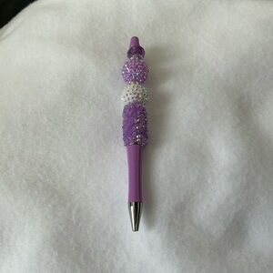 Beaded pen,black ink .